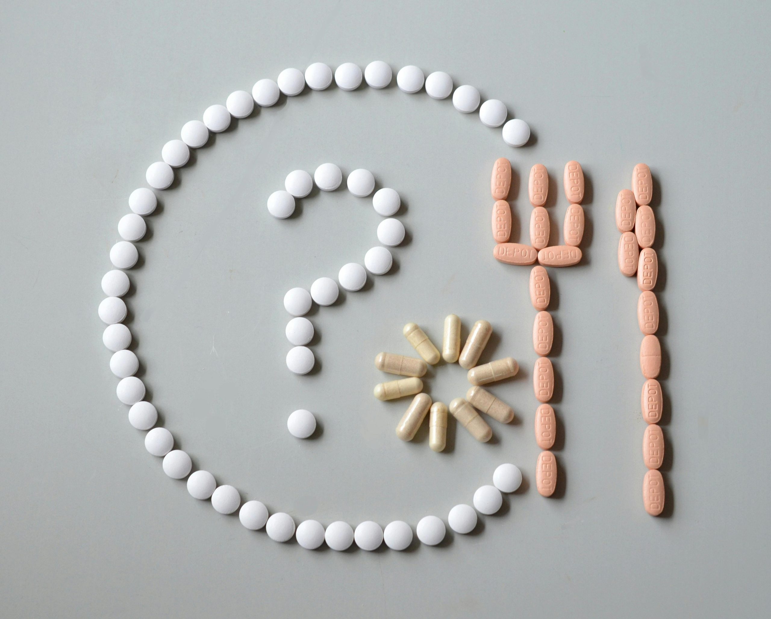 Question mark and plate made out of pills