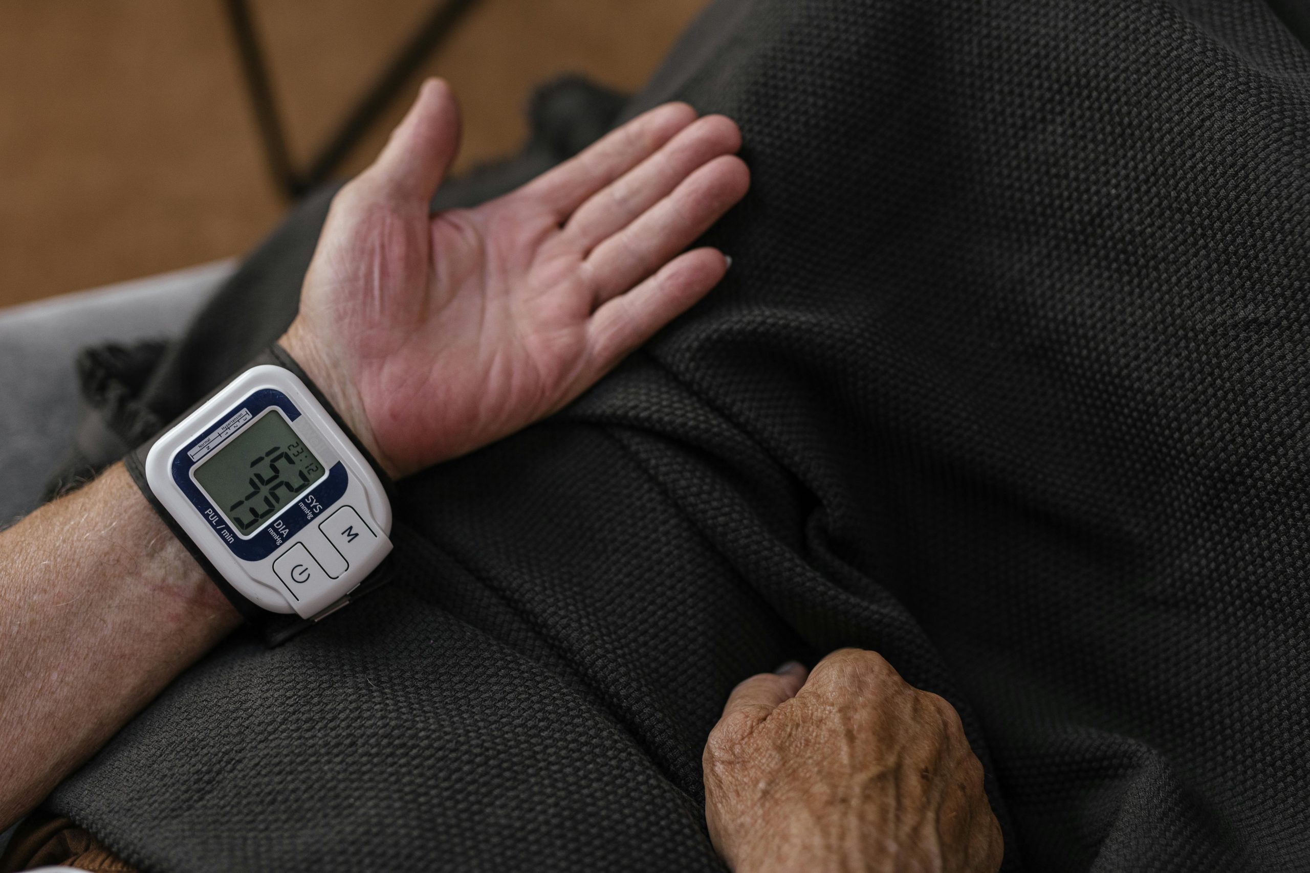 Person taking blood pressure on wrist